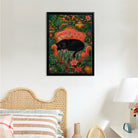 Framed Art Print of a Black Panther Resting on an Elegant Red Sofa Amidst Tropical Flowers and Greenery